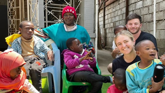 Volunteer supporting children with disabilities at a special needs centre in Arusha, Tanzania