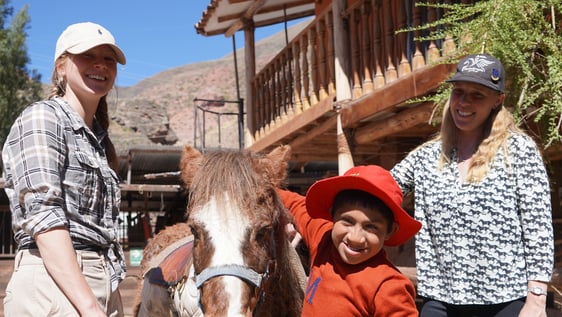 Volunteers helping with Equine Therapy