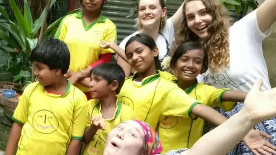 Volunteers helping underprivileged children kolkata