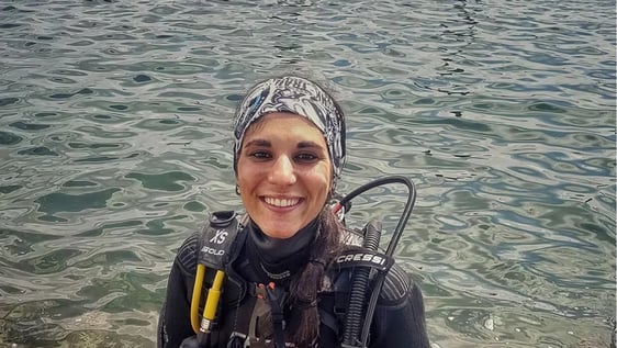 Volunteers scuba diving and collecting marine debris in Barcelona's coastal waters