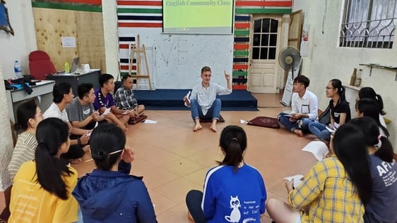 A volunteer leading an English community class in Hanoi
