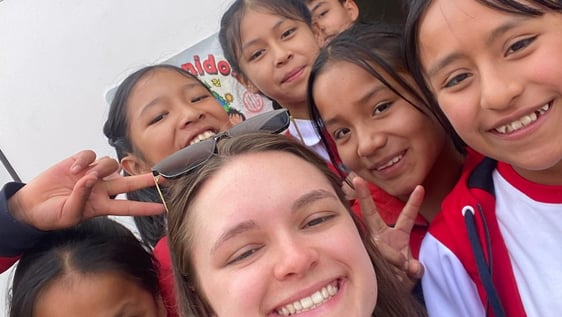 Taking a picture with the kids at the school