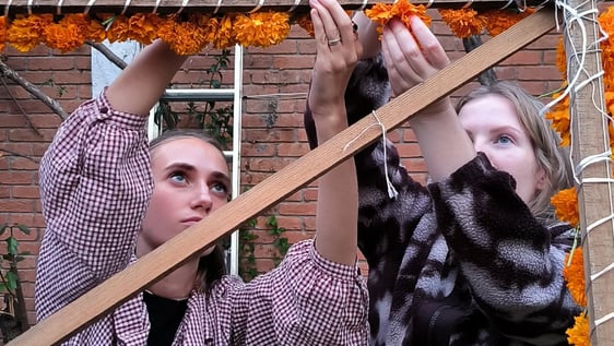 International participants building a traditional Day of the Dead altar in Mexico