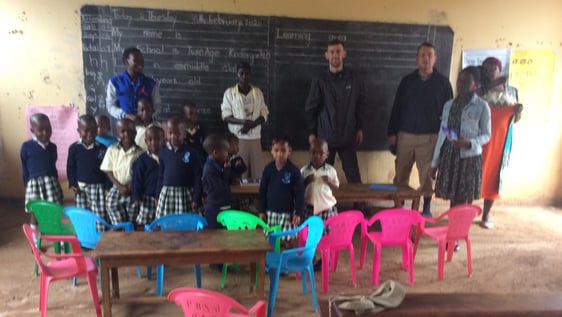 International Volunteers in class with children and local teachers.