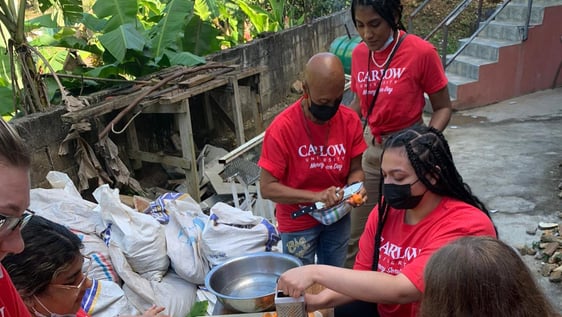 Volunteers cooking for a soup kitchen