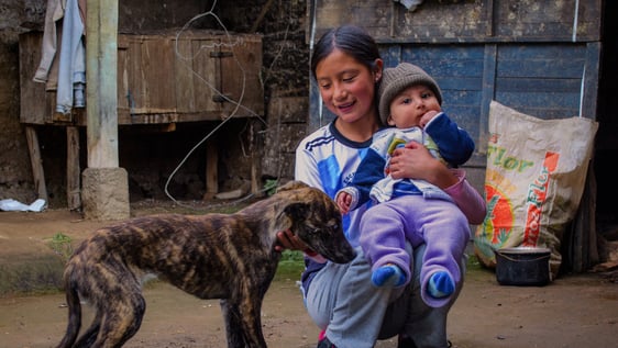 Young girl with baby 
Volunteers working Ecuador Internship Andes Rural