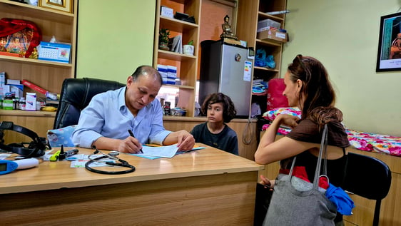 Senior  child Doctor checking a  tourist child in Kathmandu  