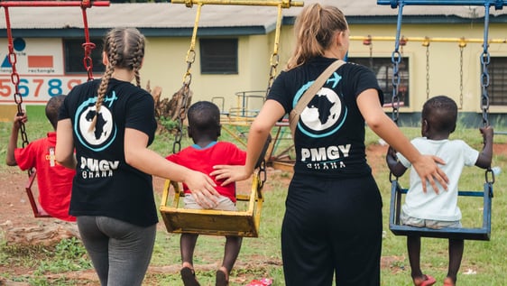 A volunteer taking care of children