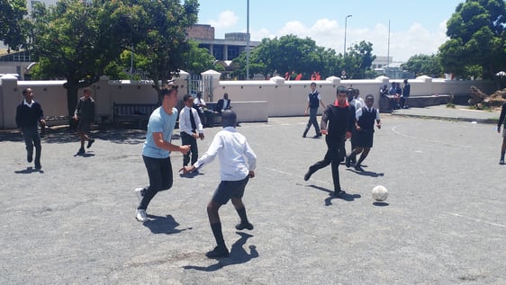 Volunteer running a sports session with schoolchildren in Cape Town, South Africa