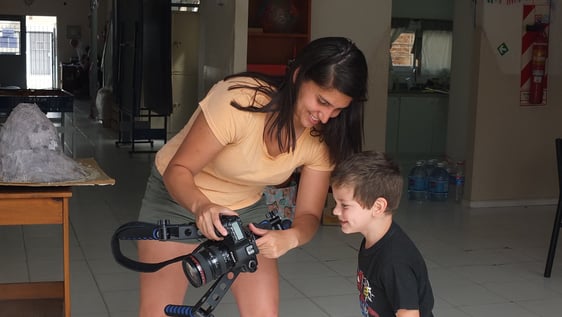 Volunteers and children understanding.