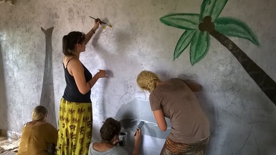 volunteer painting wall