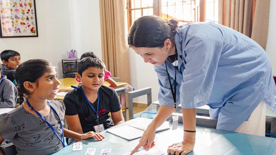 Volunteer teaching English to children in a rural school near Galle, Sri Lanka