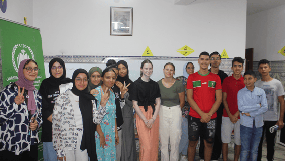 Our volunteers, Amy and Nell, are teaching English to a group of local students. 