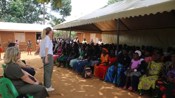 Jo from Australia motivating women in the community meeting on how to create their own  small business 